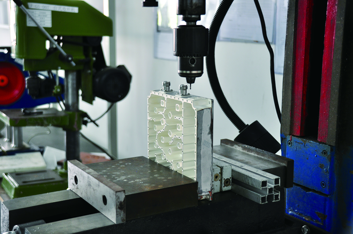 Machining an aluminum RF cavity for a passive component in the RFCOM workshop.